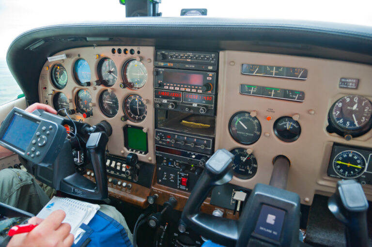Close-up of an airplane cockpit dashboard featuring flight instruments ...