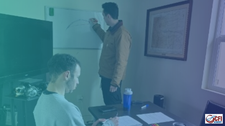 Two flight instructors in a classroom; one stands and draws a curve on a whiteboard while the other sits at a table taking notes. There are papers, a water bottle, and a phone on the table; a map is on the wall. - CFI Academy